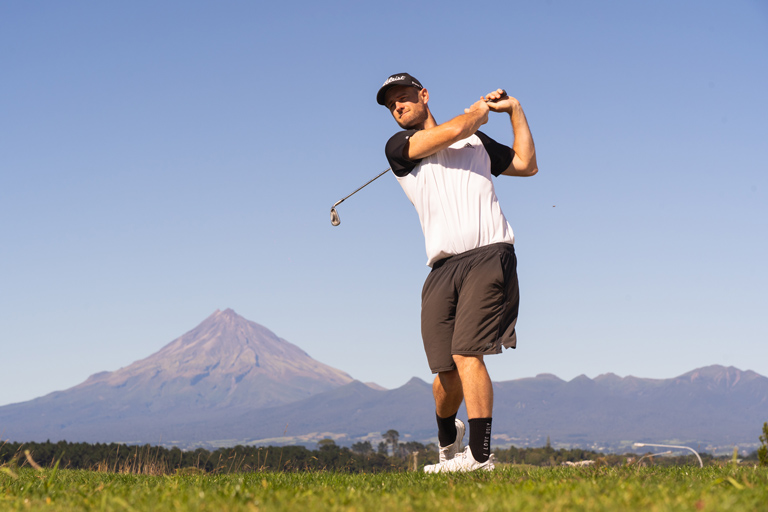 Golfing in front of Mount Taranaki