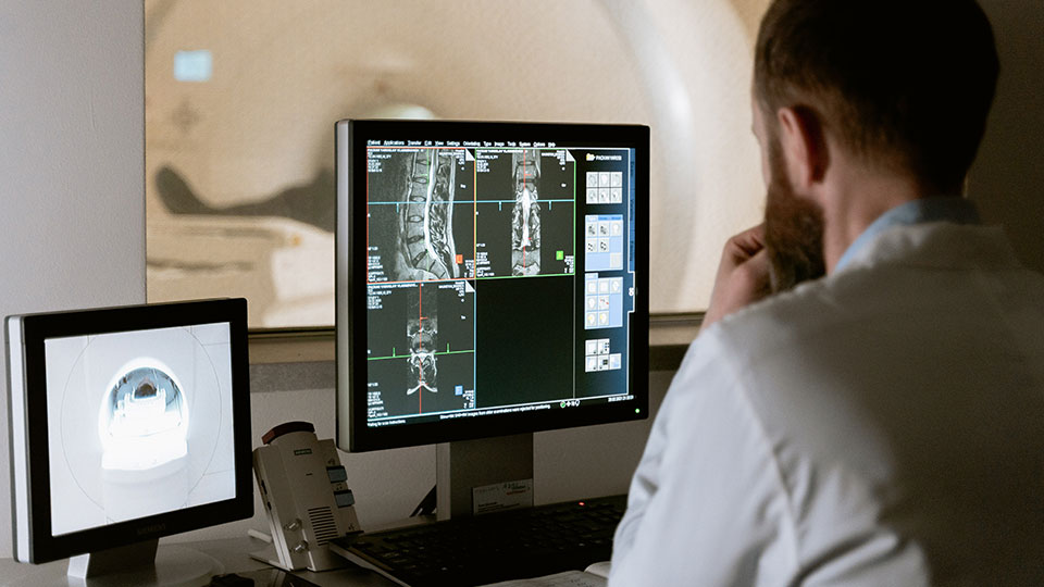 Radiographer inspecting the results from an MRI